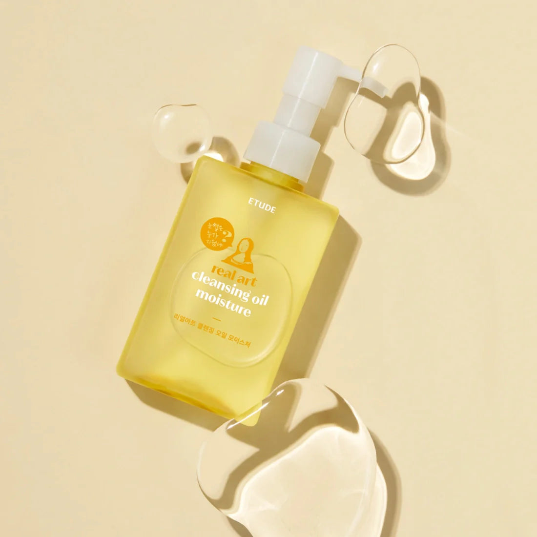 ETUDE Real Art Cleansing Oil Moisture 2-piece set (185ml+185ml) with oil spills on beige background
