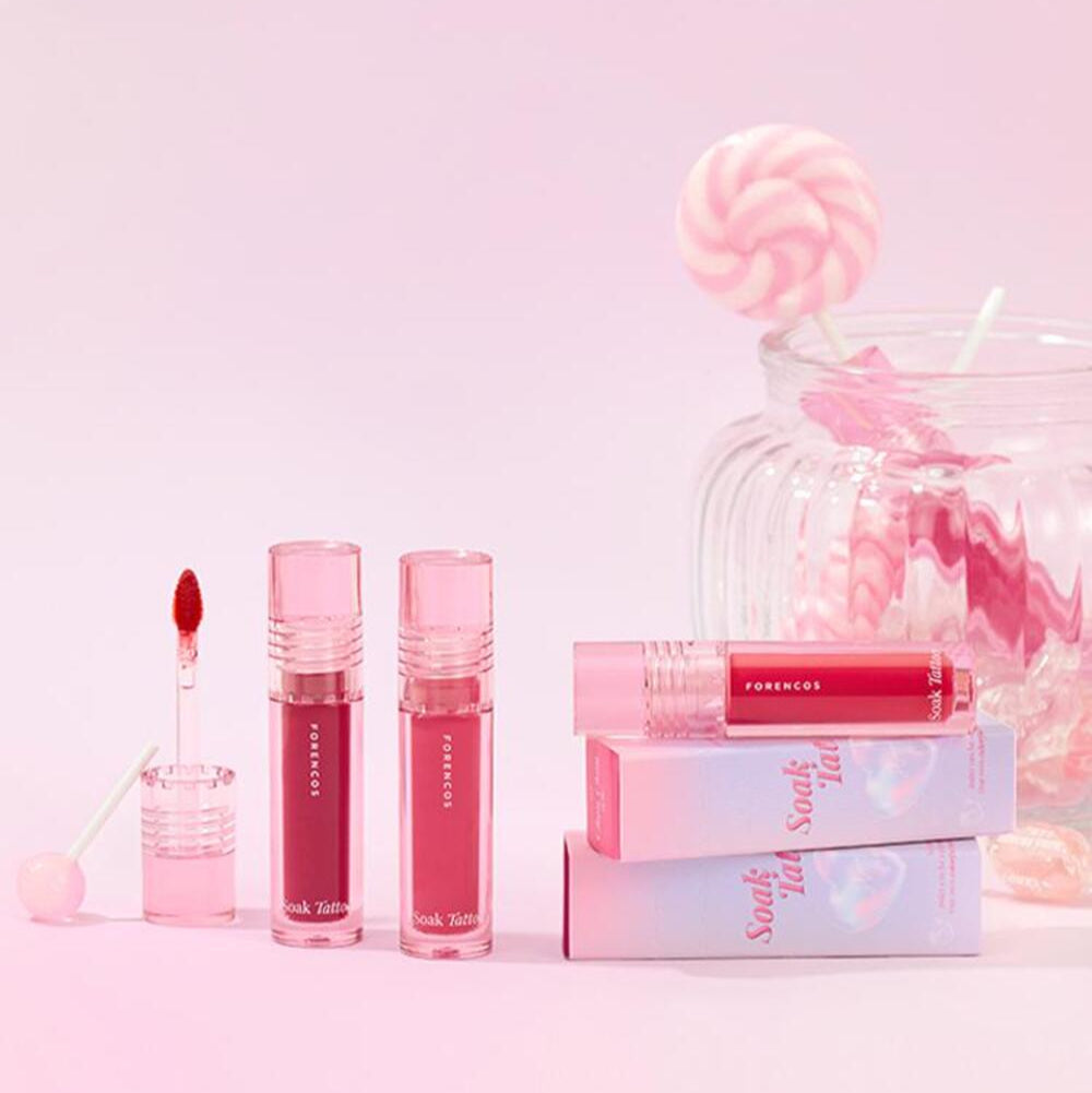 FORENCOS Renewal Tattoo Tint in vibrant pink shades with packaging and lollipop display.
