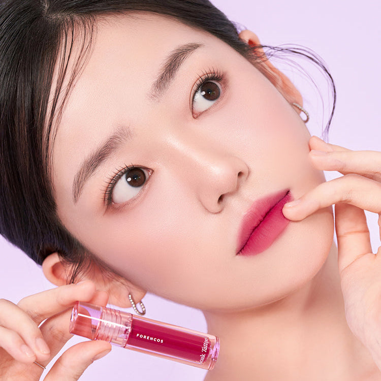 Model showcasing FORENCOS Renewal Tattoo Tint in pink shade with flawless makeup look.