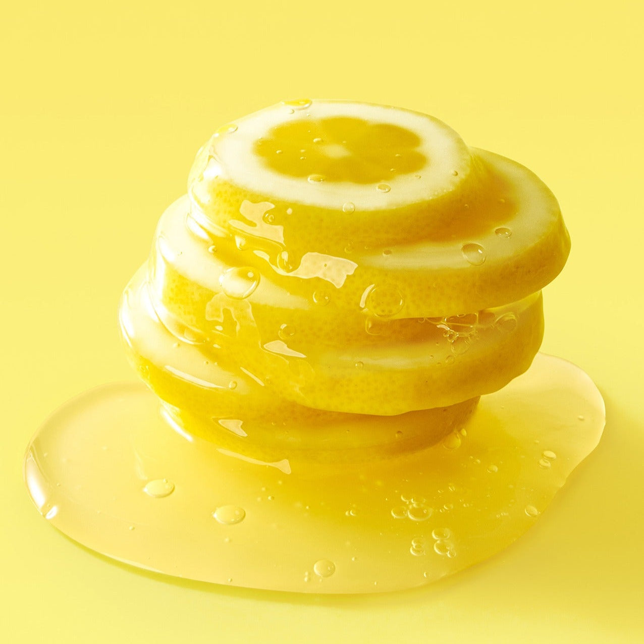 Stacked lemon slices on yellow background representing the citrus freshness of FULLY Lemon Vita Bubble Pack Cleanser 150ml.