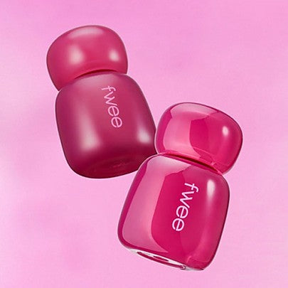 FWEE Pink Obsession Stay Fit Tint bottles on pink background, featuring vibrant design and color
