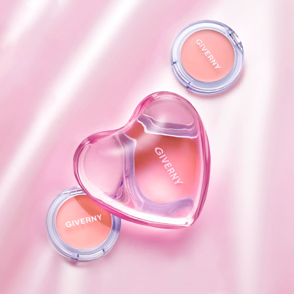 GIVERNY Dewy Gel Glow Blusher 2.7g in stylish heart-shaped packaging against a pink background, featuring two compact blushers.