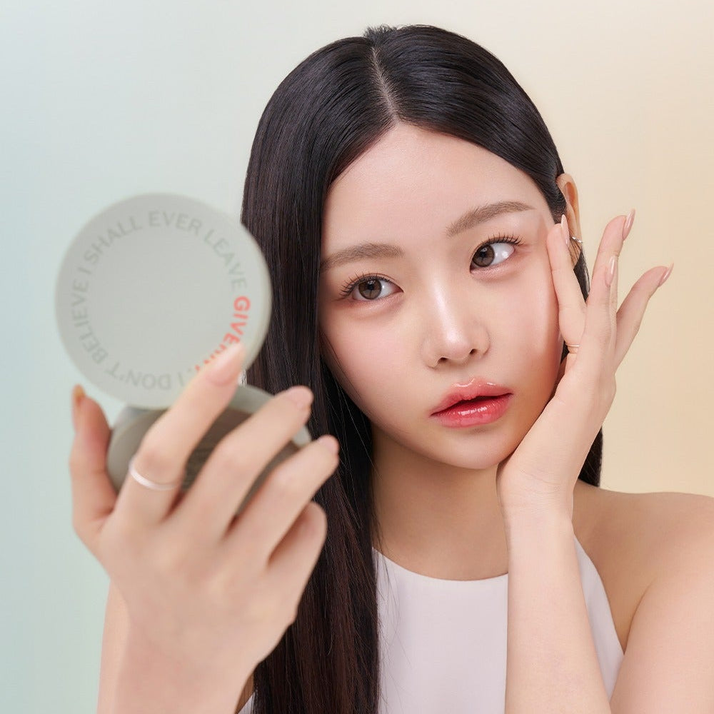 Woman applying makeup using the GIVERNY Milkchak Cover Cushion 12g.