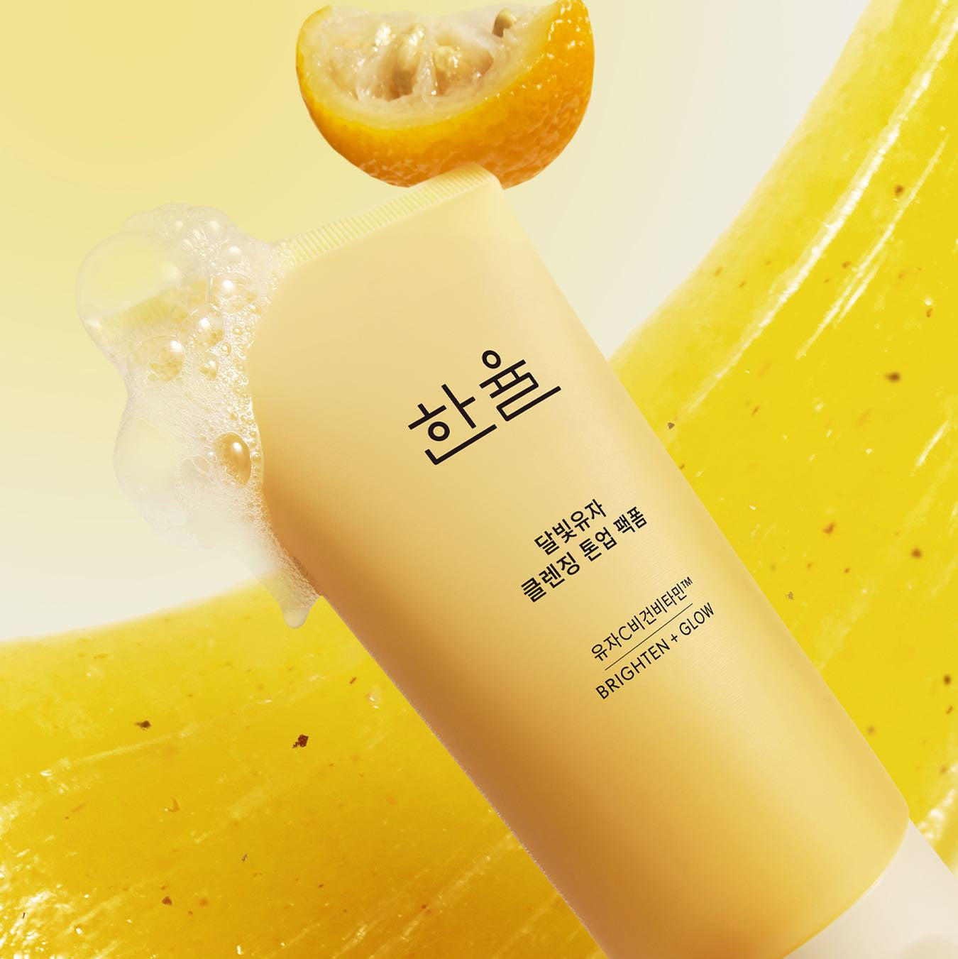 HANYUL Moonlight Yuja Vitamin Tone-Up Pack Foam 120ml skincare product with foam and yuja in background.