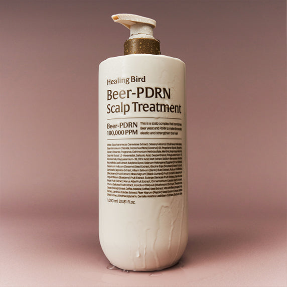 HEALING BIRD Beer PDRN Scalp Treatment 1000ml bottle against a soft pink background.