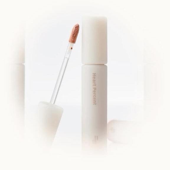 HEART PERCENT Dot On Mood All Cover Lip Base showcasing elegant design with a sleek applicator for flawless lip coverage