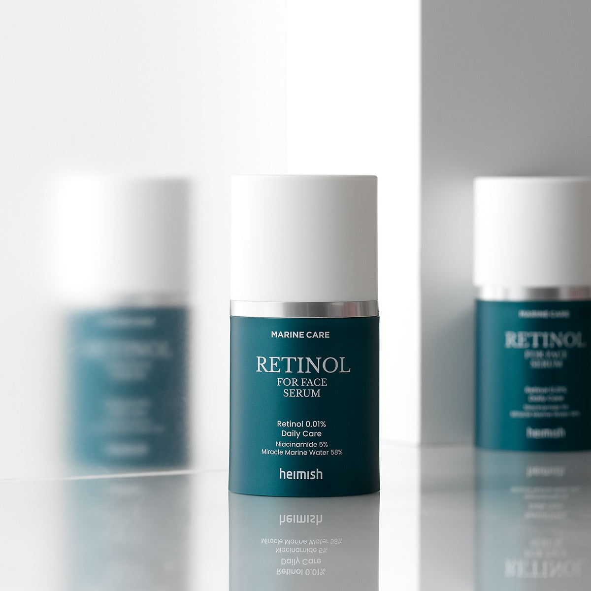 HEIMISH Marine Care Retinol For Face Serum 50ml in a sleek bottle on reflective surface