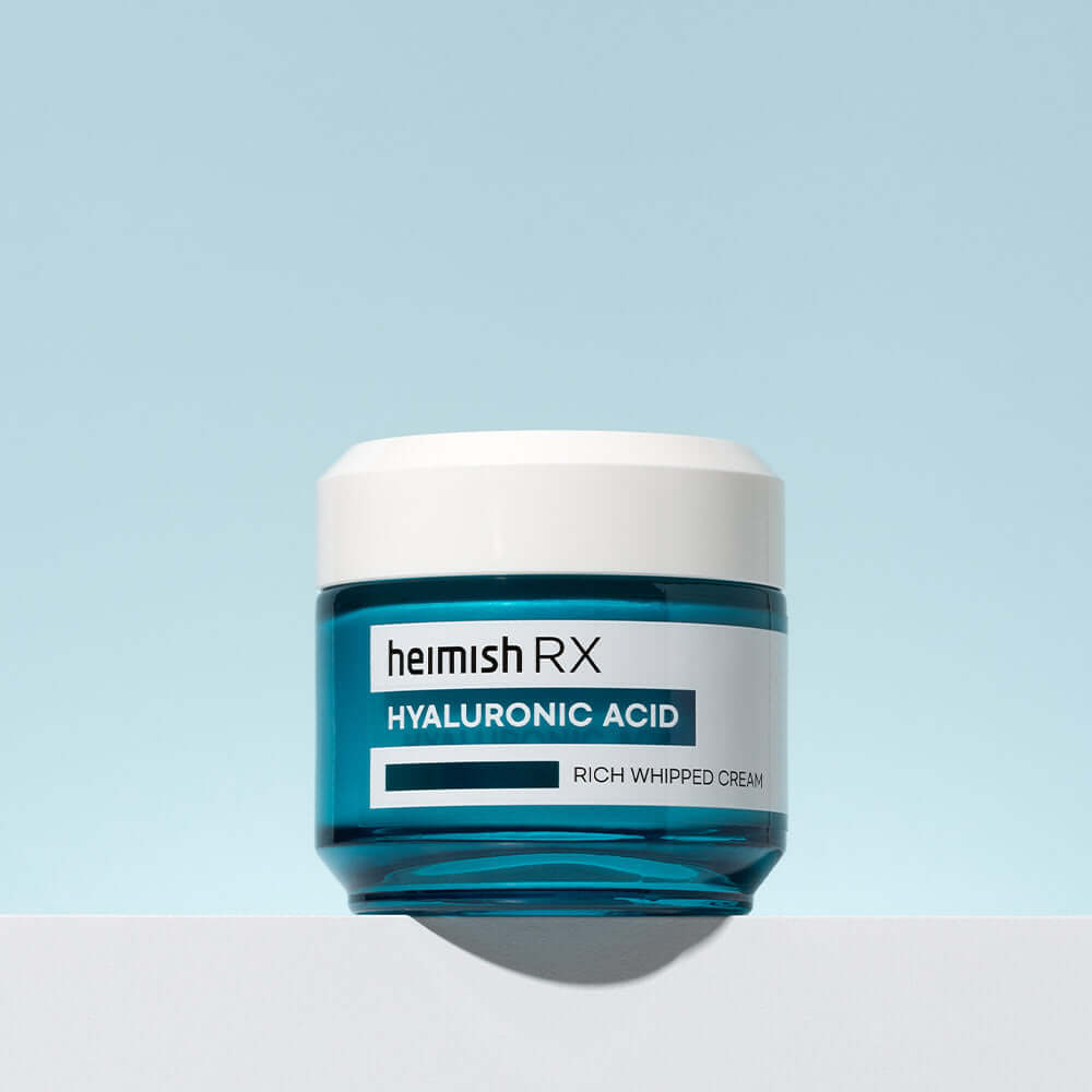 HEIMISH RX Hyaluronic Acid Rich Whipped Cream 50ml jar against a soft blue background