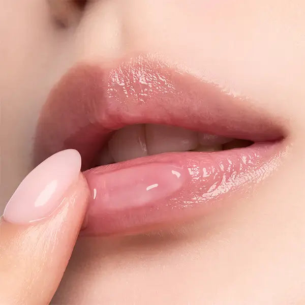 Close-up of glossy lips using HERA Lip Serum Intense 11g for hydration and shine.
