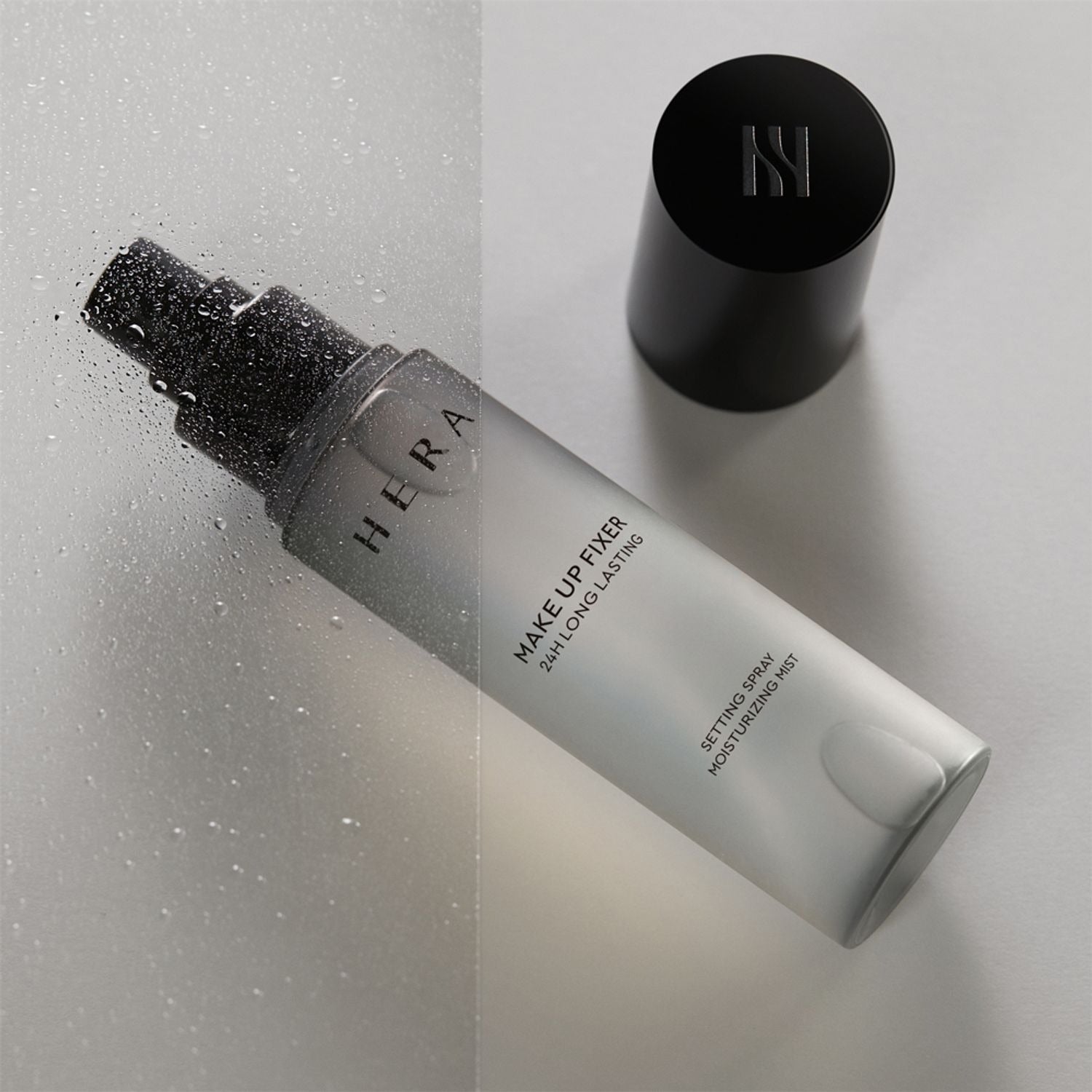 HERA Make Up Fixer 80ml in sleek black and white bottle with cap