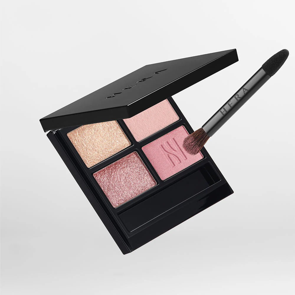 HERA Quad Eye Color eyeshadow palette with four shades and makeup brush for stunning eye looks.