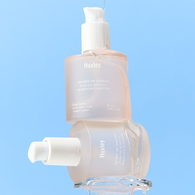 HUXLEY Hair Oil Essence Moroccan Gardener 50ml product bottle against a blue background