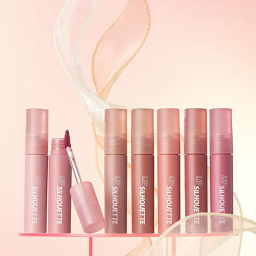 IM MEME Lip Silhouette Water Blur Tint collection in various pink shades with a focus on the applicator and soft background.