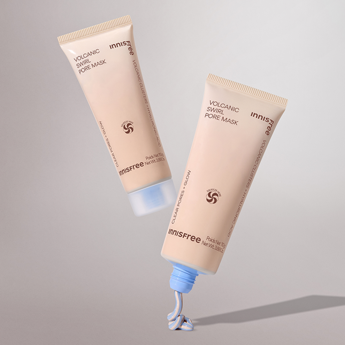 INNISFREE Volcanic Pore Dual Mask 110ml tubes showcasing product texture with open cap, perfect for deep pore cleansing and skincare.