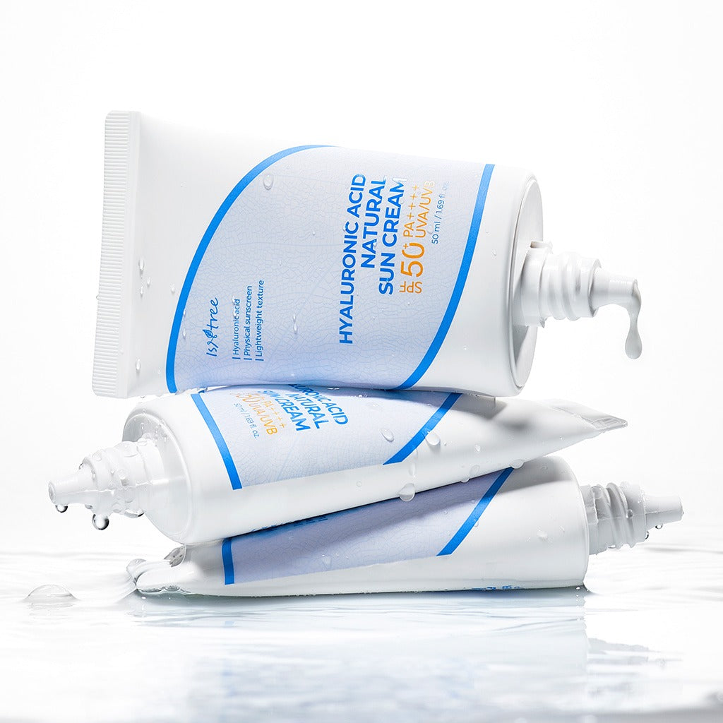 ISNTREE Hyaluronic Acid Batural Sunscreen 50ml tubes stacked with water droplets, highlighting the hydrating sunscreen's packaging.