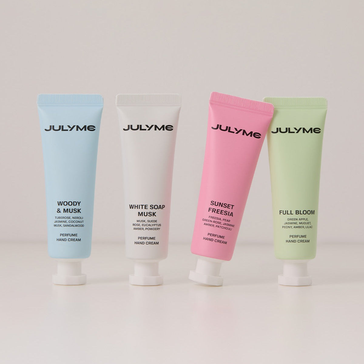 Four varieties of JULYME Perfume Shea Butter Hand Cream 30ml in different colors: Woody & Musk, White Soap Musk, Sunset Freesia, Full Bloom