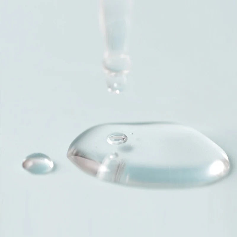 Close-up of JUMISO D-Panthenol Barrier Soothing Serum 70ml texture with liquid dropper, showcasing its hydrating formula.