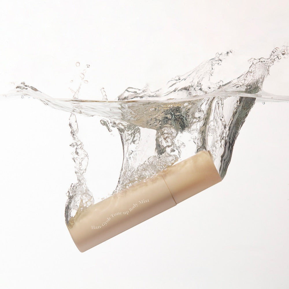 KAHI One Layer Tone-up Body Miist 100ml bottle splashing into clear water