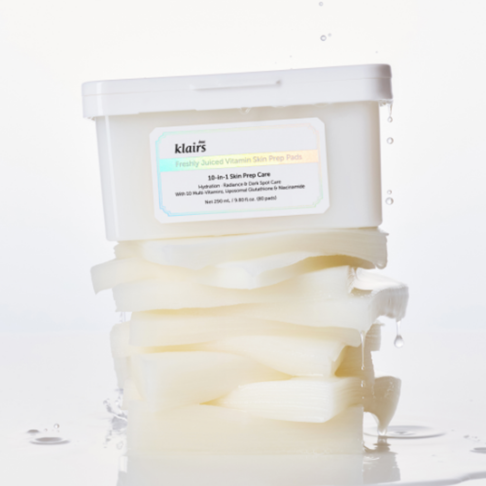 KLAIRS Freshly Juiced Vitamin Hwajalmeok Pad 80 sheets displayed with stacked, moist skincare pads on a white background.