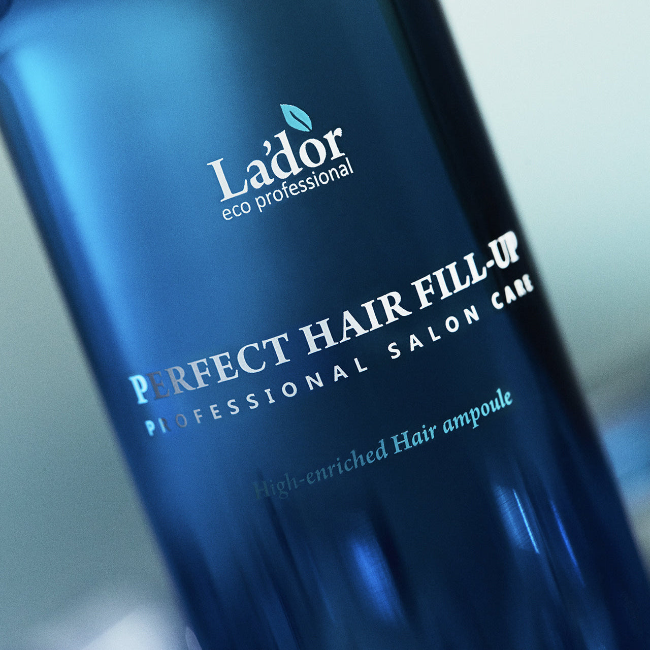 Close-up of LADOR Perfect Hair Fill-Up 150ml bottle, showing label and branding.