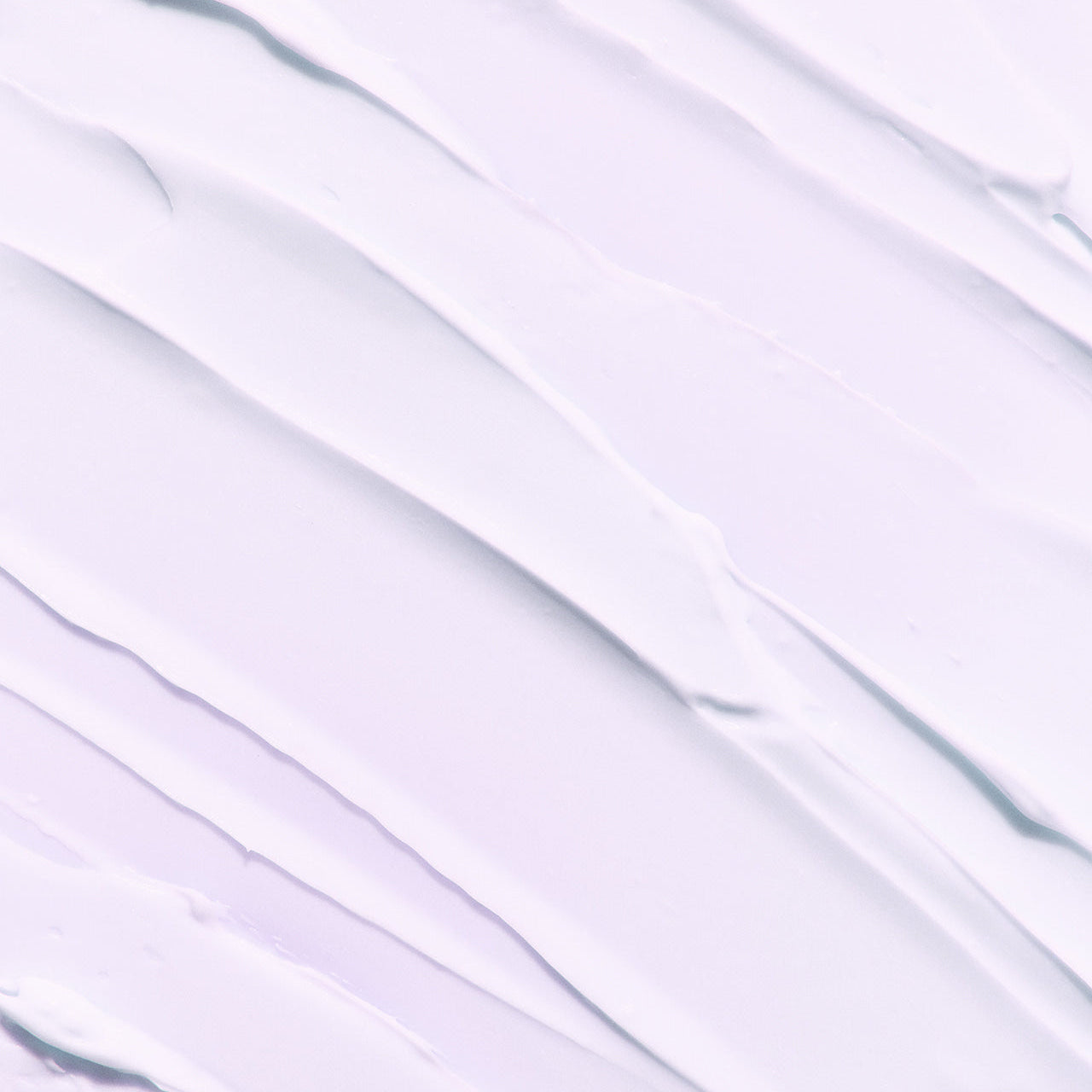 Texture of LADOR Volumizing Curl Cream 80ml spread on a surface, showcasing its smooth and creamy consistency.