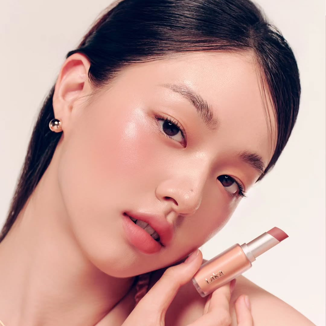 Model showcasing LAKA Bulky Matte Lipstick with a close-up view emphasizing the lip color.