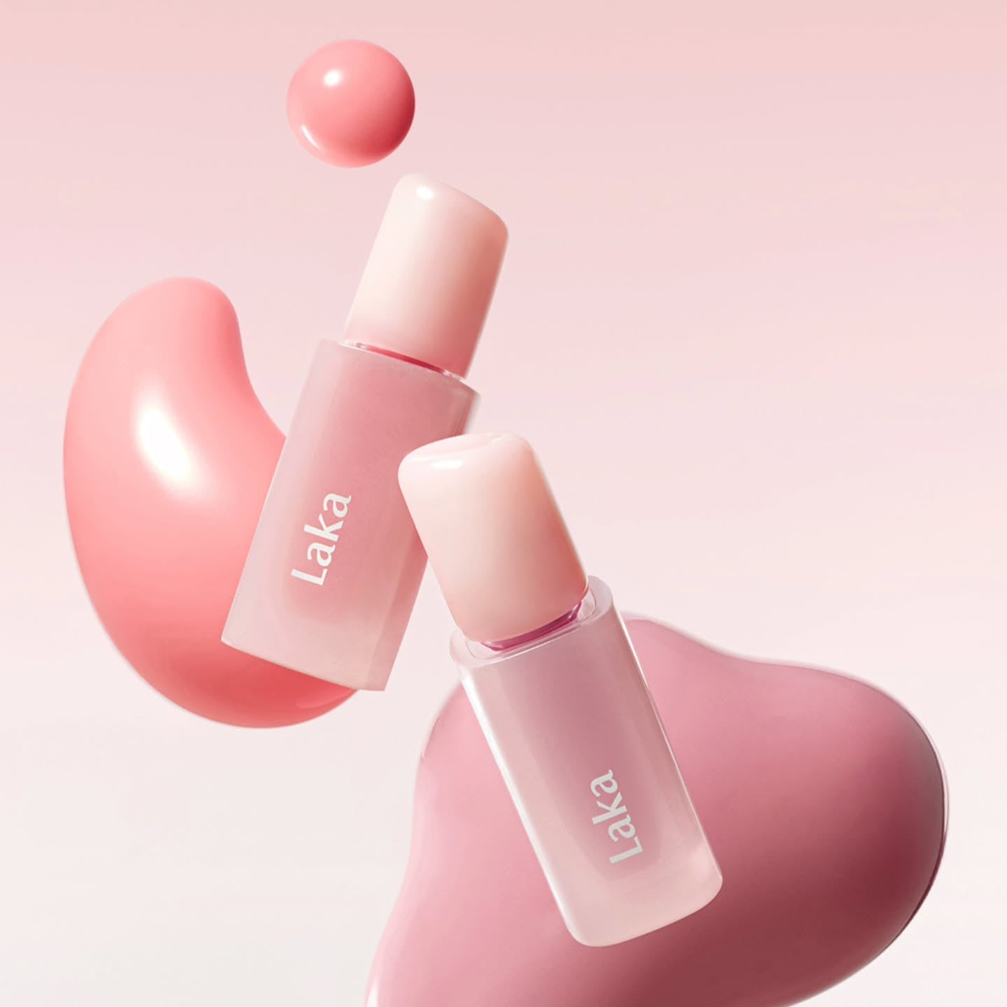 LAKA Popping Ballon Tint in pink shades with artistic splashes, perfect for vibrant lip color.