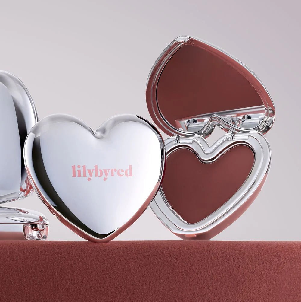 Heart-shaped LILYBYRED Love Beam Cheek Mousse compact with burgundy blush shade
