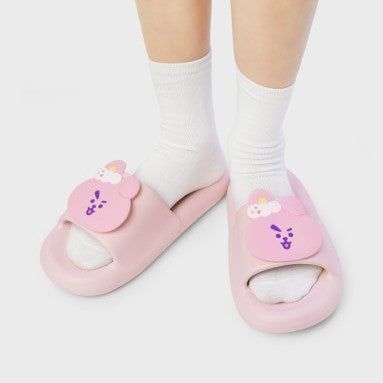 LINE FRIENDS BT21 On The Cloud Edition Slippers in pink, worn with white socks, featuring cute character designs.