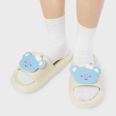LINE FRIENDS BT21 On The Cloud Edition Slippers with cartoon bear design on child's feet.