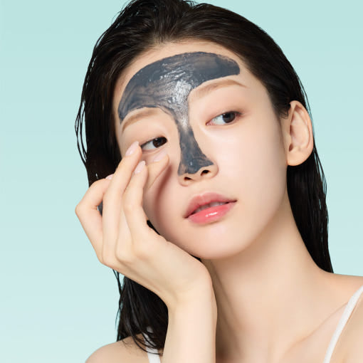 Woman applying a nose strip, beauty skincare routine