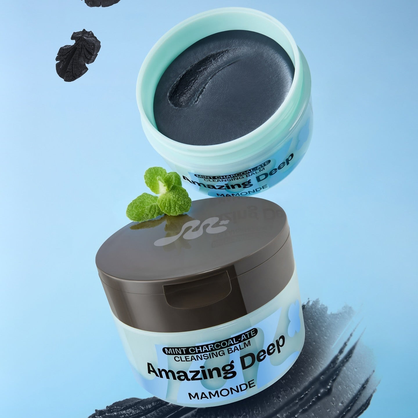 MAMONDE Amazing Deep Mint Chocolate Cleansing Balm 90ml in open and closed containers on blue background with mint leaves.