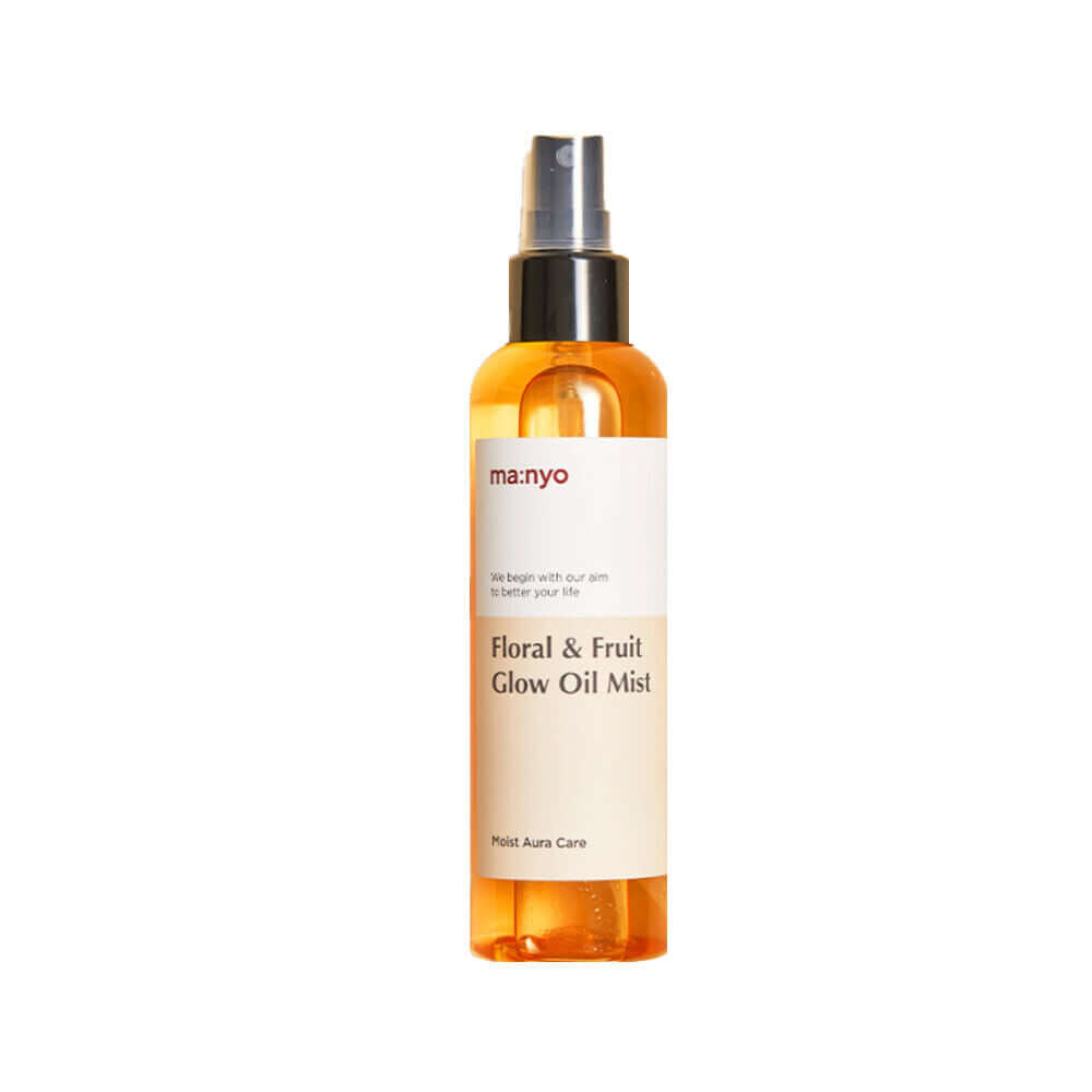MANYO Floral & Fruit Glow Oil Mist 150ml in orange bottle with spray nozzle, enhancing skin radiance with natural floral and fruit extracts.