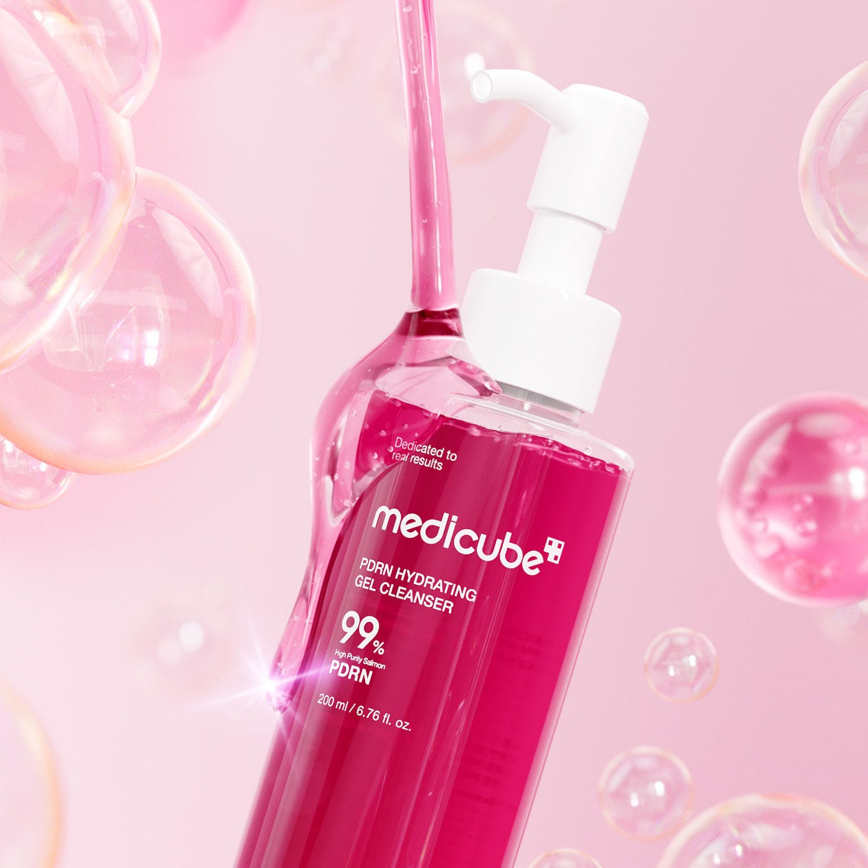 MEDICUBE PDRN Gel-To-Foam Cleanser 200ml bottle with bubbles and pink background.