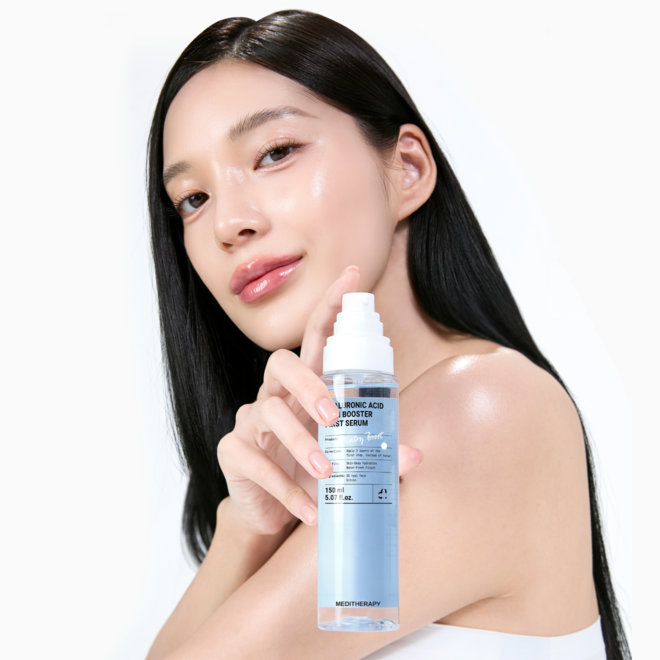 Woman holding MEDITHERAPY Hyaluronic Acid Skin Booster First Serum 150ml bottle showcasing glowing skin
