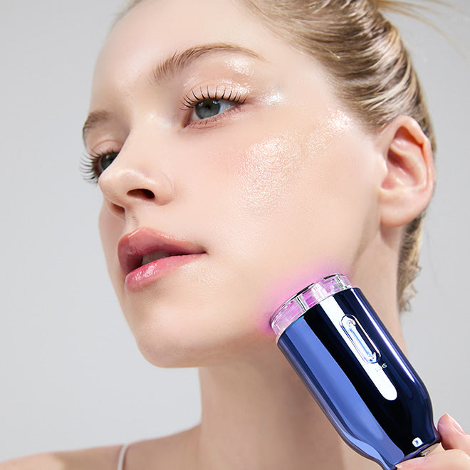 Woman using MEDITHERAPY Inmotox Suction Jet (+Peptide Shot Cream) 50ml + EMS Device on face for skincare treatment.