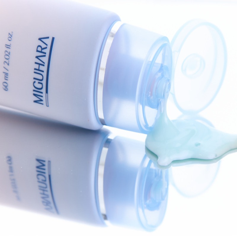 MIGUHARA Aqua Refresh Relief Peel Off Mask Pack 60ml tube with product spilling out on a reflective surface.