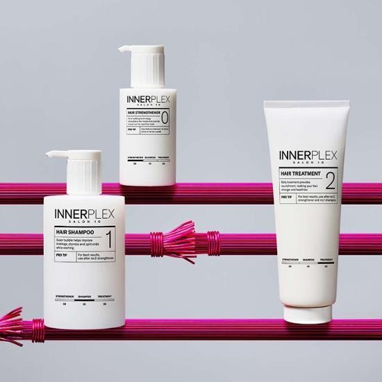 MISE EN SCENE Innerplex Hair Strengthening Treatment 240g displayed with shampoo and hair treatment on pink rods