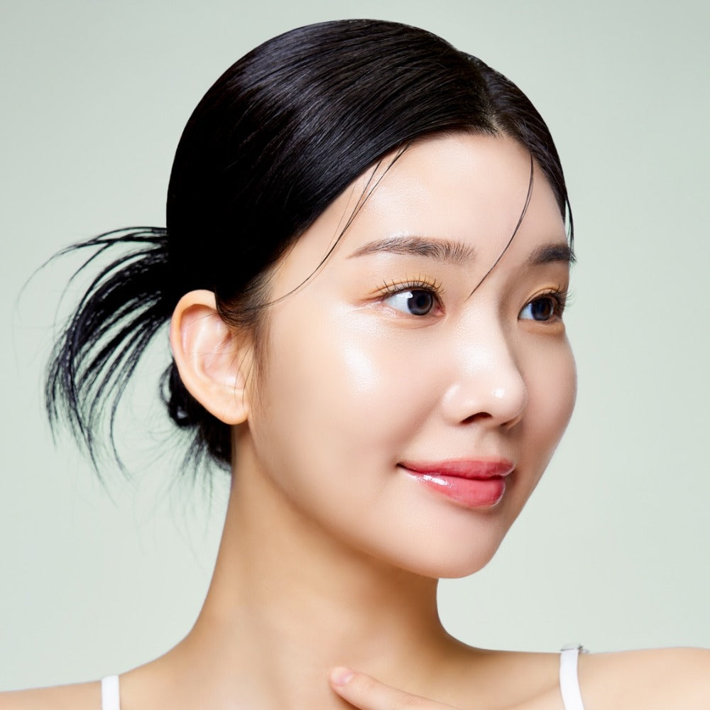 Woman with glowing skin possibly using MIXSOON Cica Hyal Deep Soothing Cream 50ml