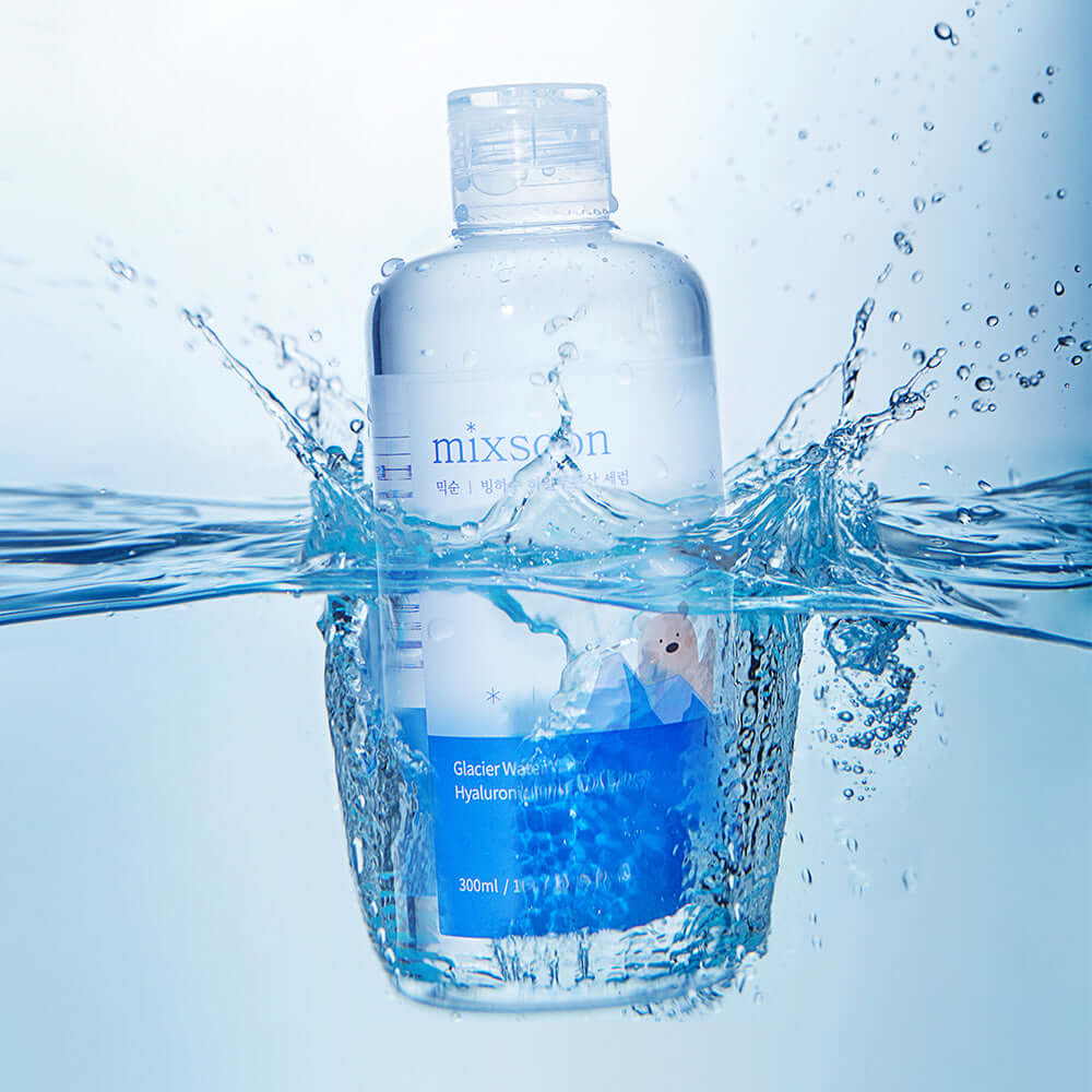 MIXSOON Glacier Water Hyaluronic Acid Serum 300ml bottle splashing in water, highlighting hydration and skincare benefits.