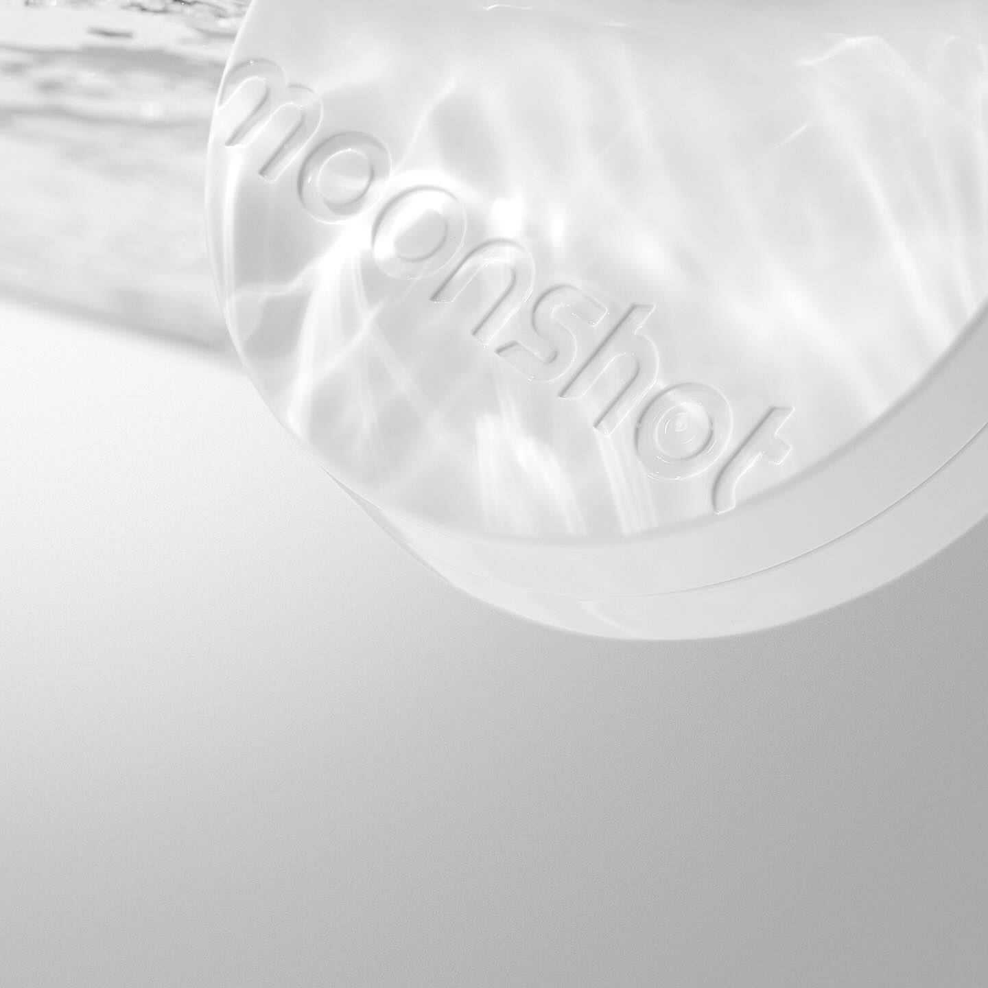 MOONSHOT Conscious Fit Glow Cushion Foundation compact with water reflection