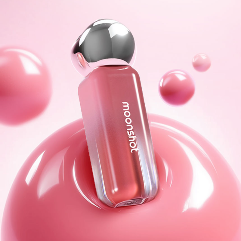 MOONSHOT Jelly Moon Glow Tint on pink glossy surface with bubbles