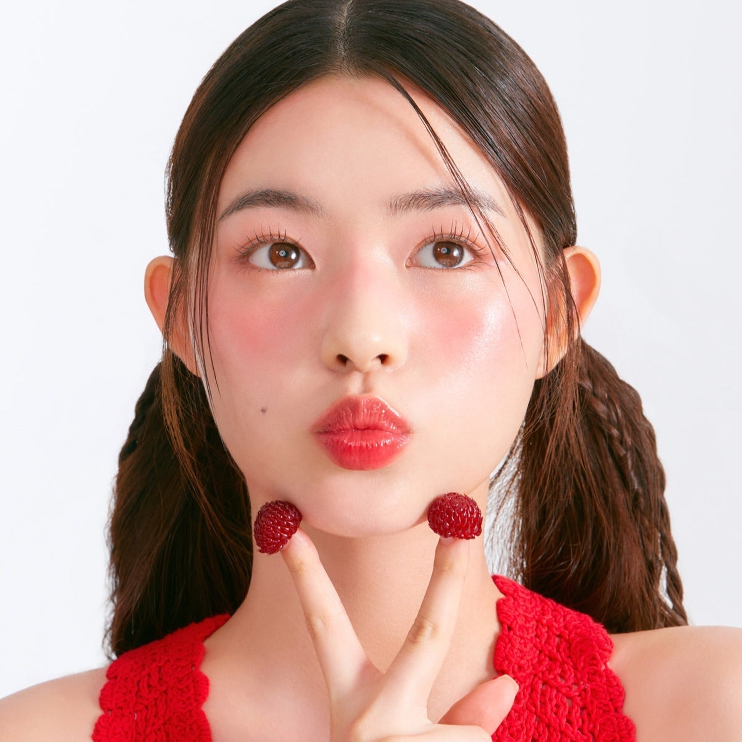 Woman wearing MOONSHOT Melting Mood Lip & Cheek with berry accents and red top