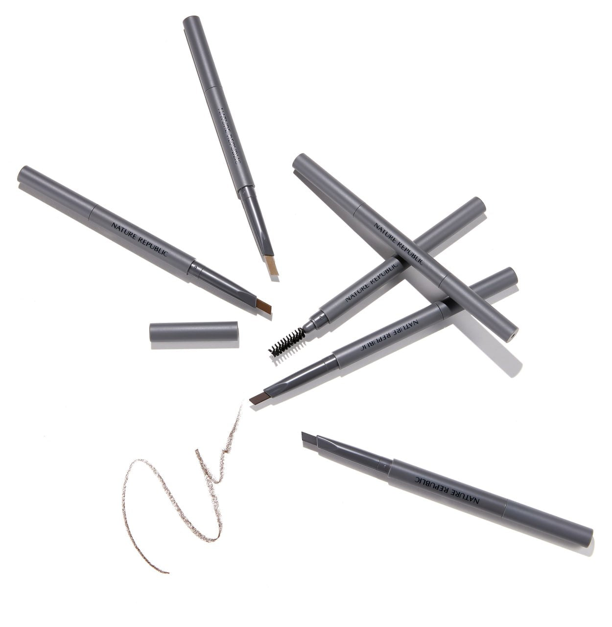 NATURE REPUBLIC Botanical Auto Eyebrow pencils in gray, showcasing tips and textures, ideal for precise eyebrow styling.