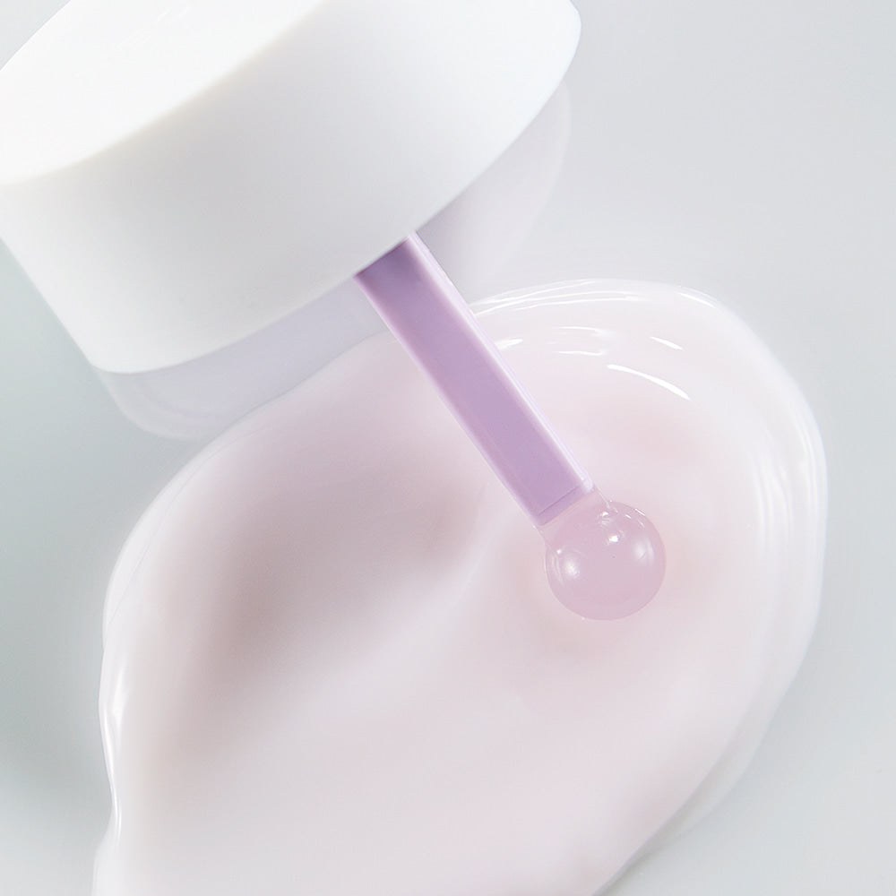 Close-up view of NEOGEN V Biome Soothing Cream 60g with a lavender applicator and cream texture on white background.
