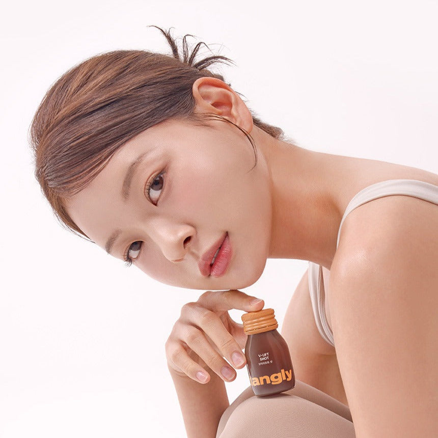Model posing with NOTHING BETTER Tangly V-Life Shot 7 Bottles, showcasing beauty and wellness product.