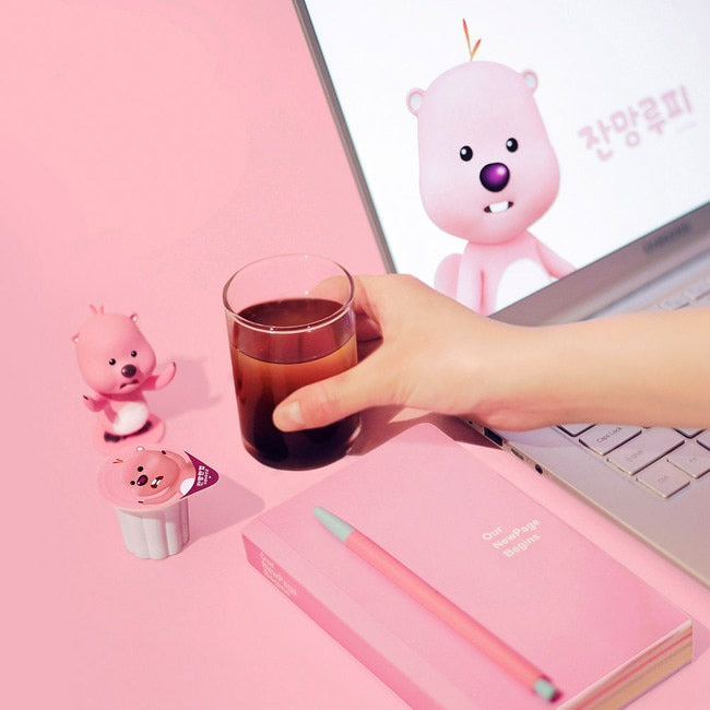 NOTHING BETTER Zanmang Loopy Cup Purun & Lactobacillus 14p next to a laptop and pink notebook on a pink background.