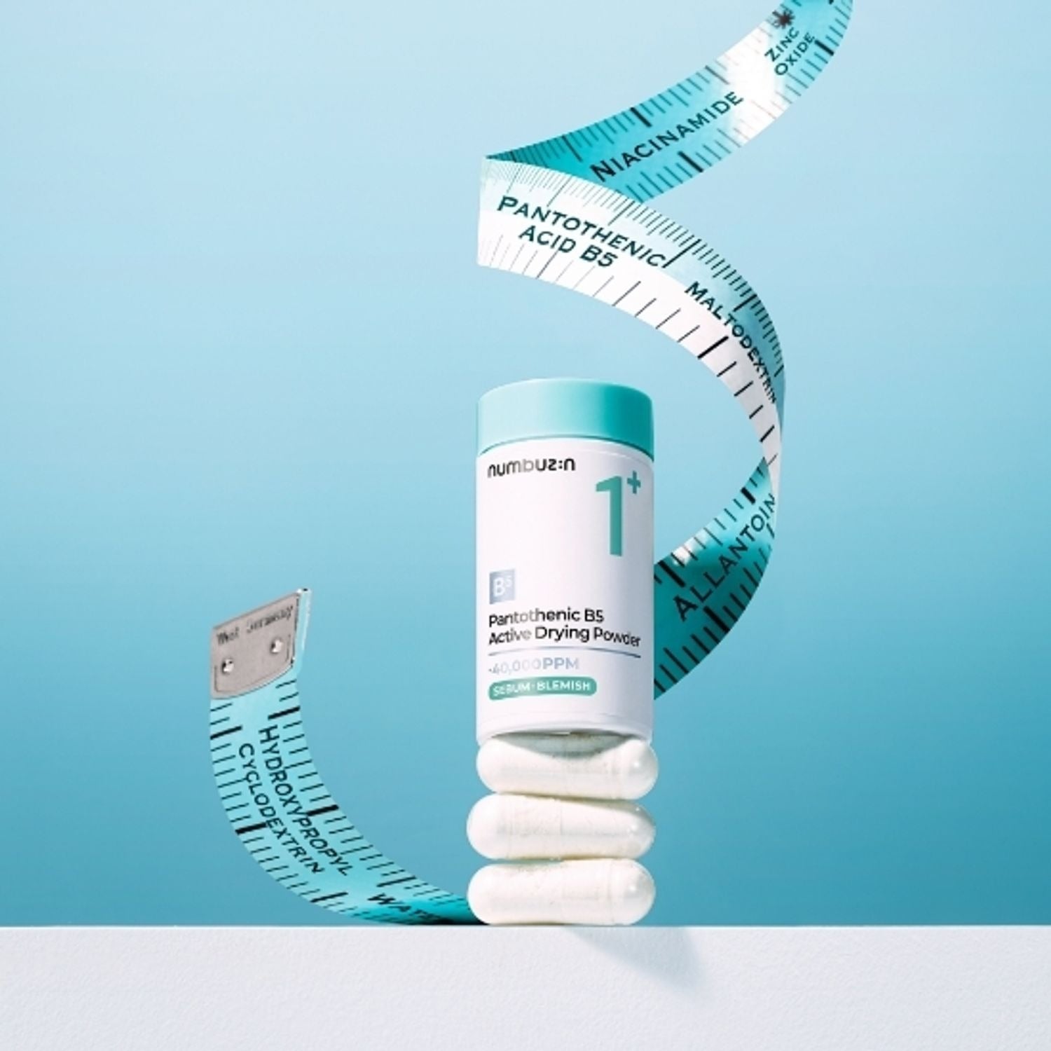NUMBUZIN No.1 Pantothenic Acid Active Up Dressing Powder 7g with measuring tape on light blue background