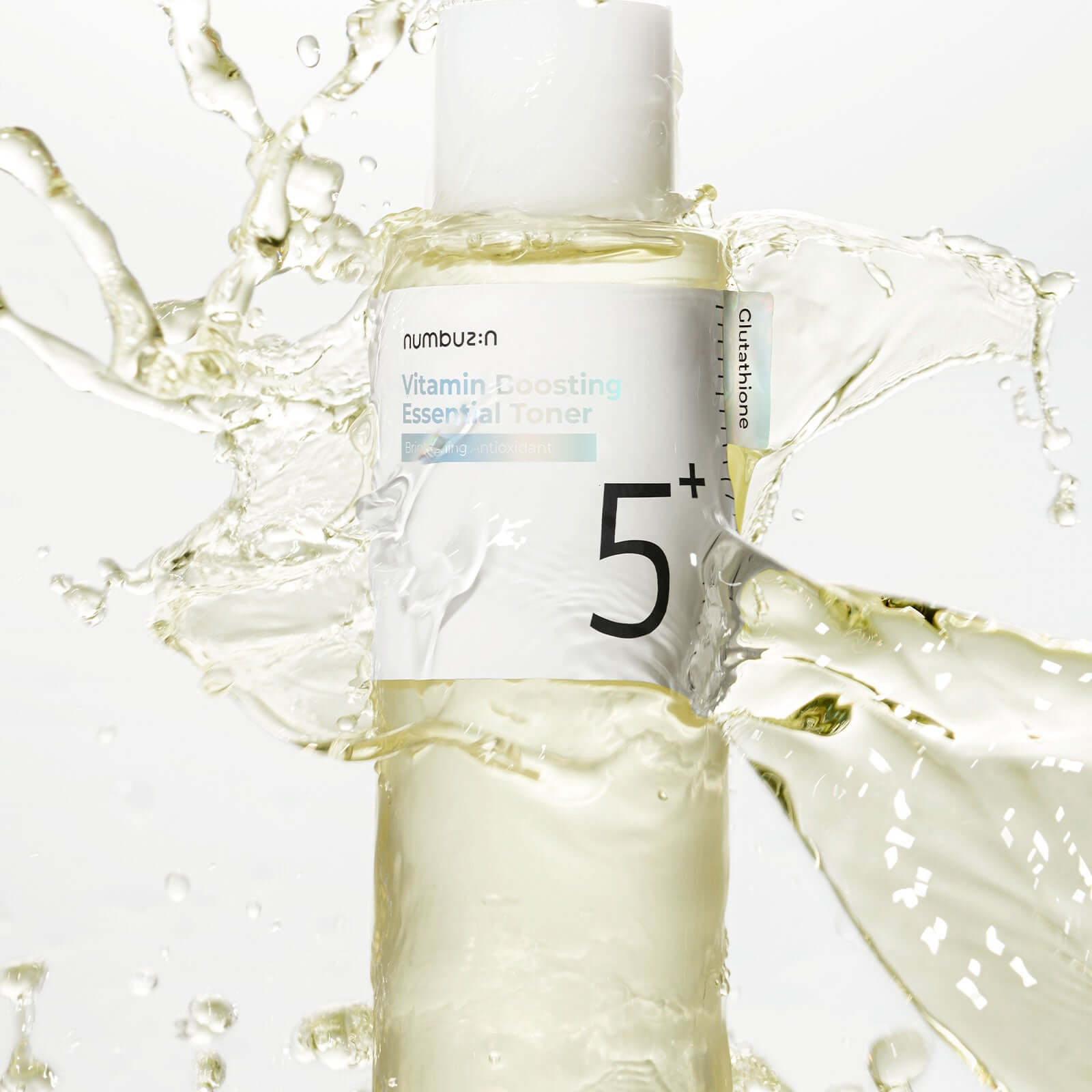 NUMBUZIN No.5 Vitamin Boosting Essential Toner bottle with splashing liquid background