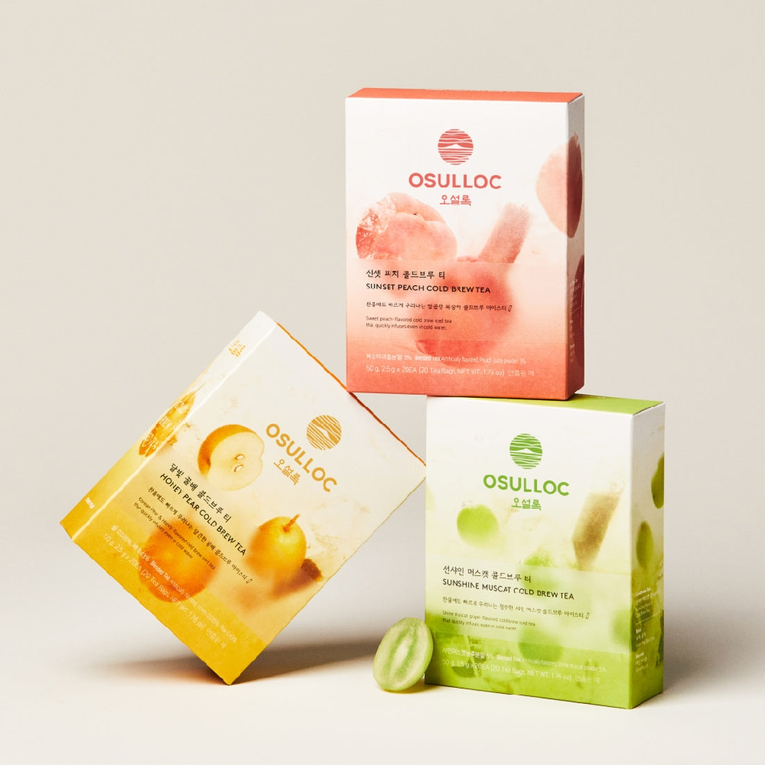 Boxes of diverse OSULLOC Cold Brew Teas, including the OSULLOC Moonlight Honey Pear Cold Brew Tea 20 P, arranged in a display.